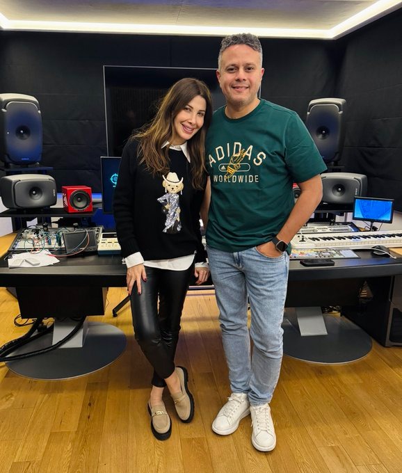 نانسي عجرم مع المنتج محمد حامد.
