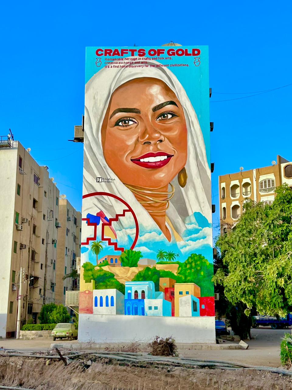 علي عبد الفتاح ومها جميل.. ثنائي جداريات الشارع يبدع في تزيين وجه أسوان