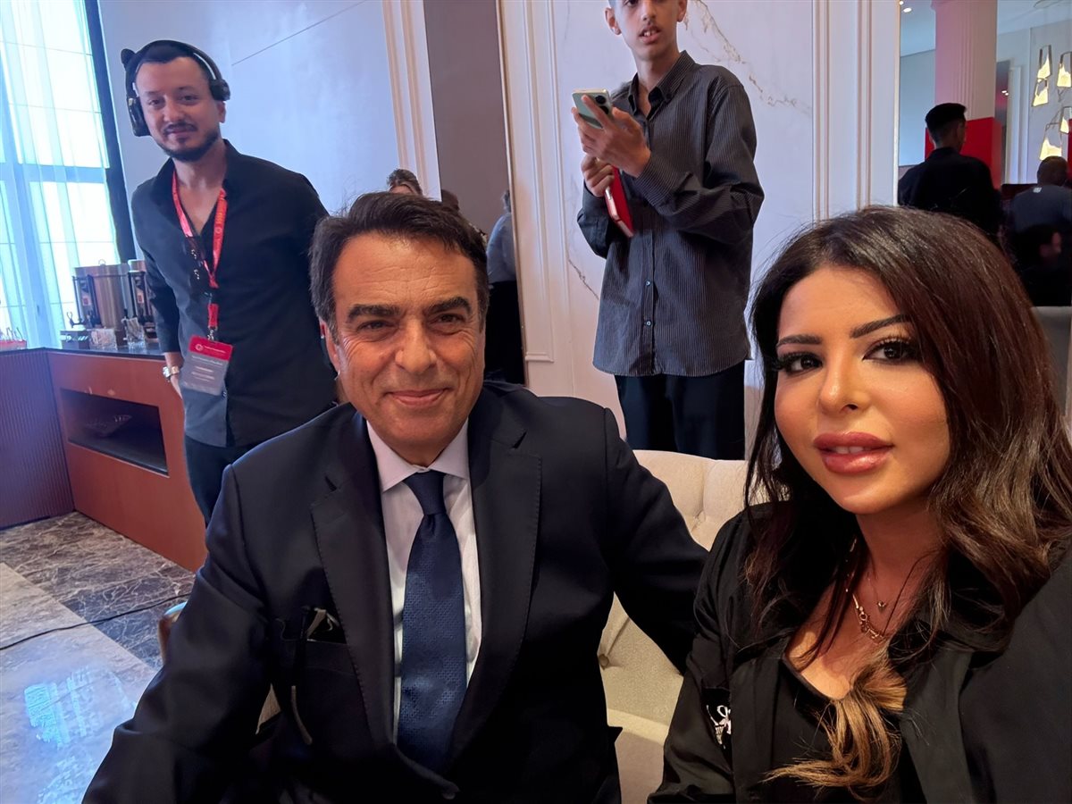 الإعلامي جورج قرداحي والصحفية دعاء خطاب