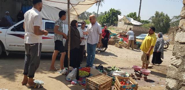 بائعة الخضروات بعد نقلها لمكانها الجديد بالسوق 01