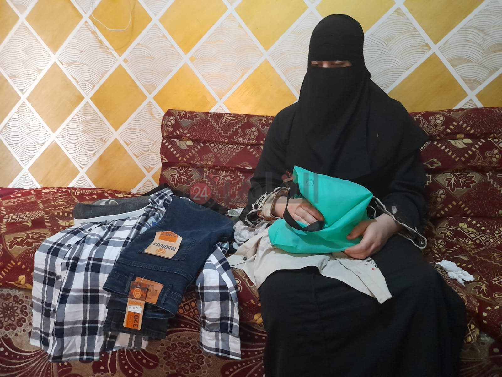 زوجة شهيد الشهامة وملابس العيد التي اشتراها ولم يلبسها