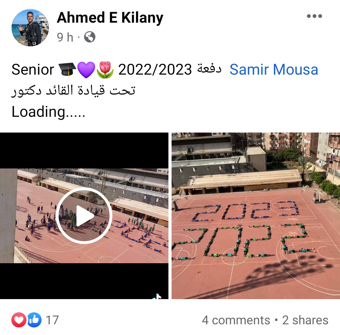 أحد طلاب الدفعة يحتفي بكتابة اسم الدفعة