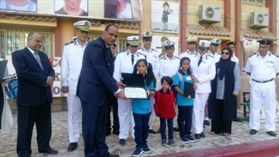 وفد من مديرية أمن القاهرة يصطحب أبناء الشهداء لمدارسهم