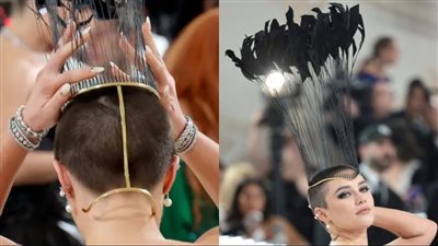 حفل ميت جالا.. فلورنس بيو تصدم الجمهور حليقة الرأس وترتدي تاجًا من الريش