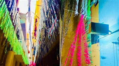 عملناها في يومين.. أهالي بولاق الدكرور بالجيزة يعلقون زينة رمضان بألوان علم فلسطين