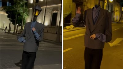 بهدف الحفاظ على البيئة.. فتاة تتنكر في شكل عمود إنارة بشوارع الإسكندرية تثير فضول المارة