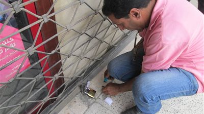 غلق وتشميع محل للزيوت ومطعم ومخزن للملابس بالدقي حفاظا علي سلامه المواطنين