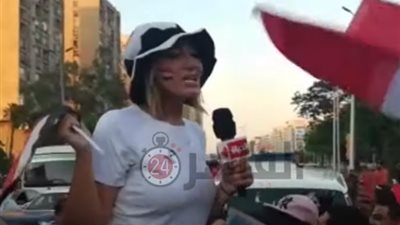 ريهام سعيد تتجول بمحيط ستاد القاهرة بالأعلام لمساندة المنتخب الوطني (فيديو)