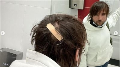 الصحفي الروسي يصل إلى بلاده بعد أزمته في حي الزبالين