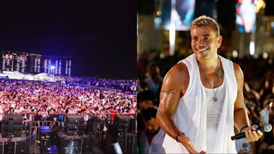 ساحة أرينا العلمين تمتلئ بالجمهور في انتظار عمرو دياب.. وتوافد الحشود على البوابات مستمر | صور